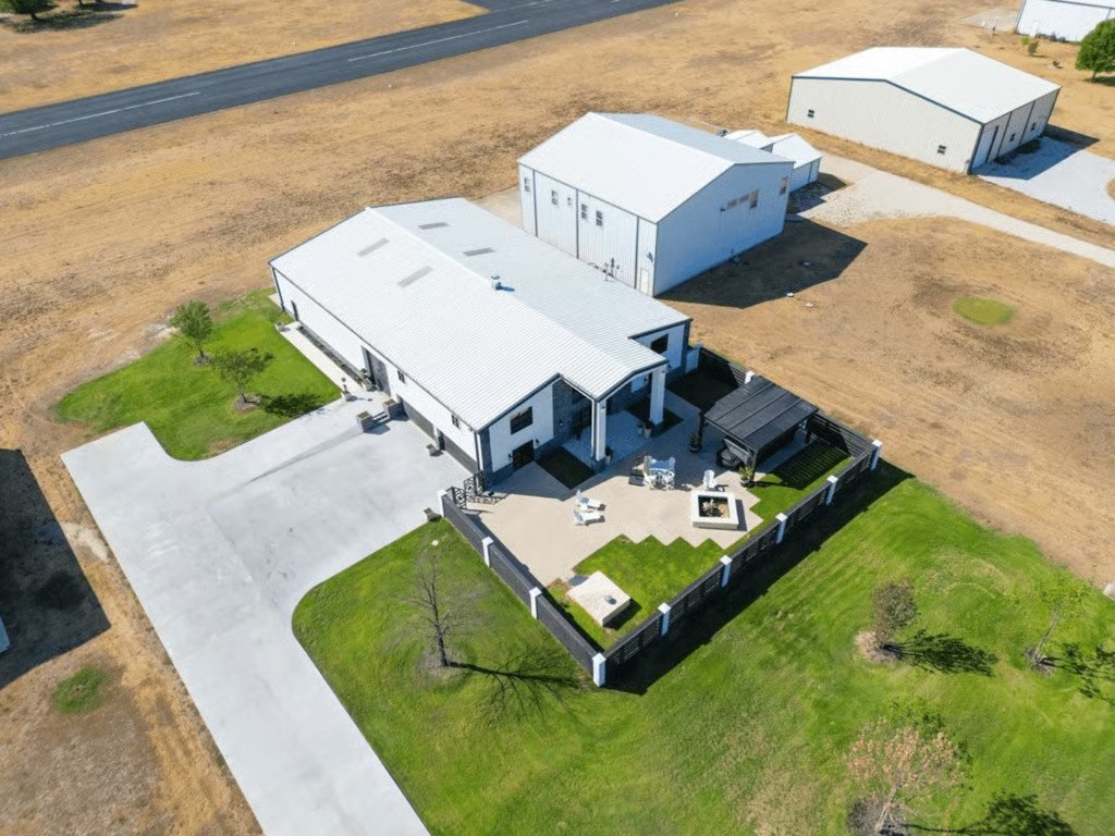 Aerial view of the Justin, TX home with its private hangar and runway.